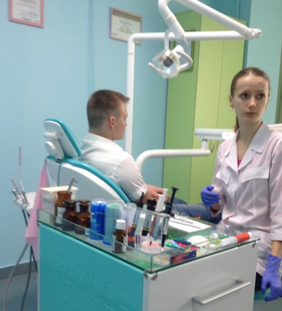 Zhenya at the dentist, accompanied by Last Bell's staff